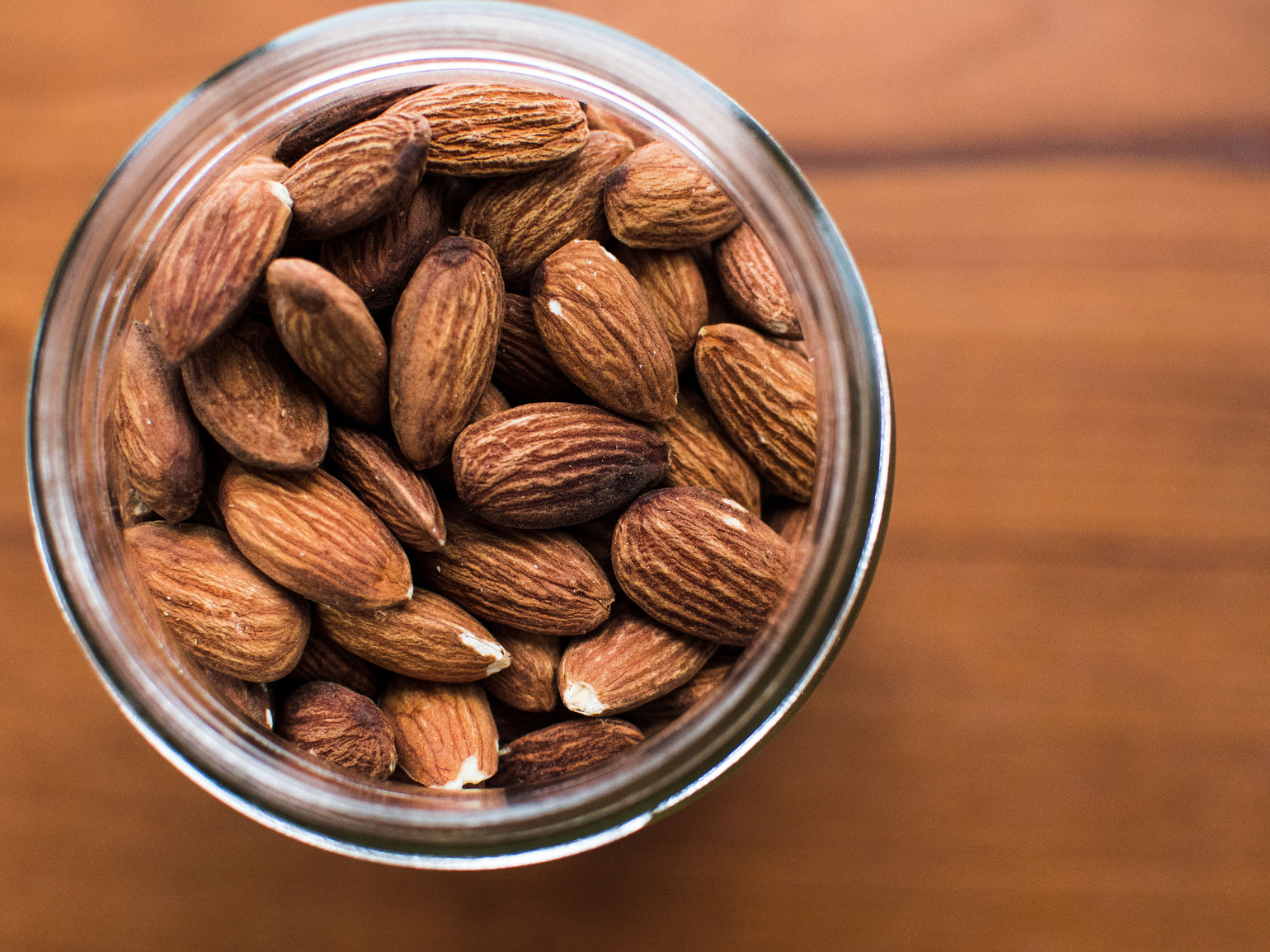 Aerial view of a jar of almonds