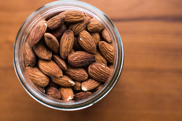 Aerial view of a jar of almonds